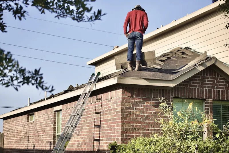 Professional roofer working on a residential roof in Yorktown